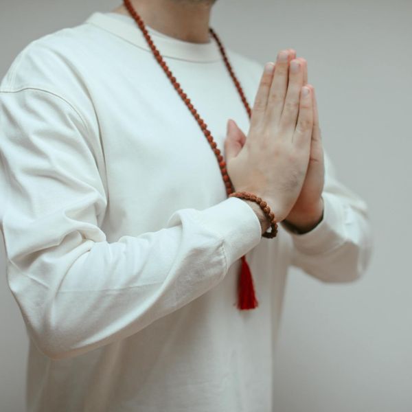 Person meditating peacefully in a yoga pose, symbolizing inner calm and renewed energy.